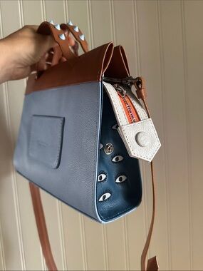 Min & Mon Vali cross body clutch Blue and Brown Top-Handle Bag with eyes design